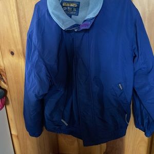 Men’s large Woolrich blue coat with light green lining.
